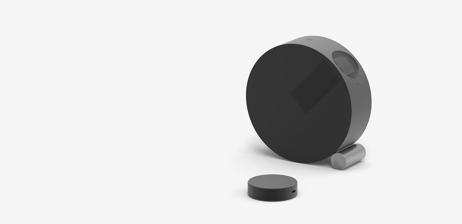 Rosmo Namino — round charcoal speaker object with steel base